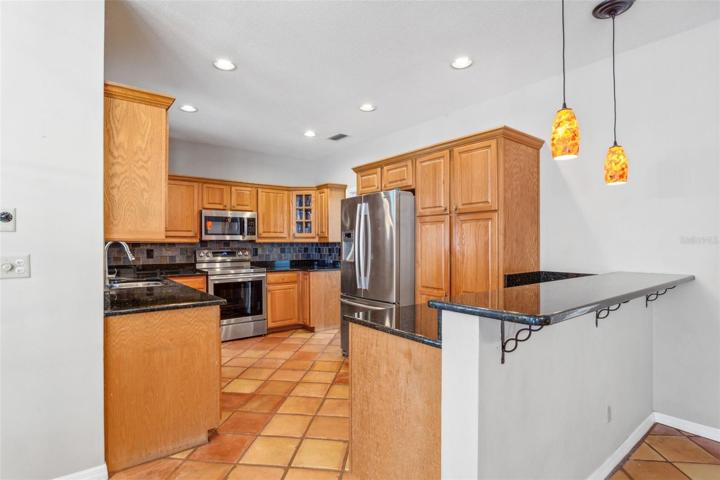 Breakfast bar flows seamlessly into family room.