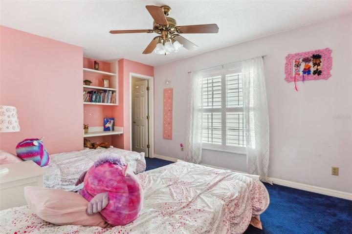 Two of the bedrooms have custom built-ins/desk area.