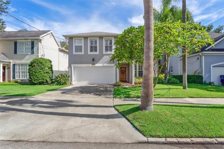 Inviting curb appeal with mature landscaping.