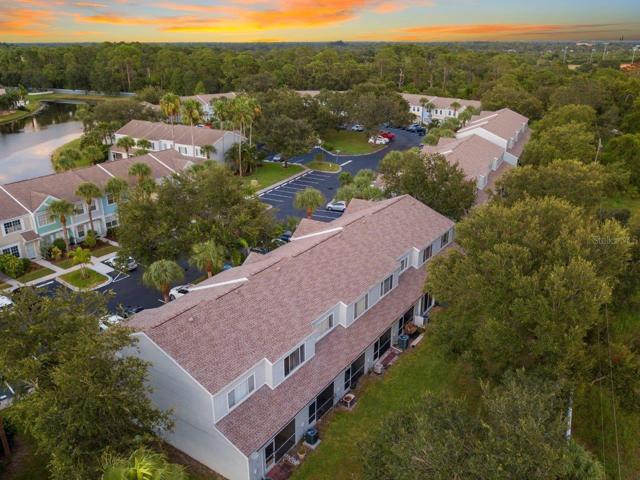 Aerial showing the back side of the building and back yards