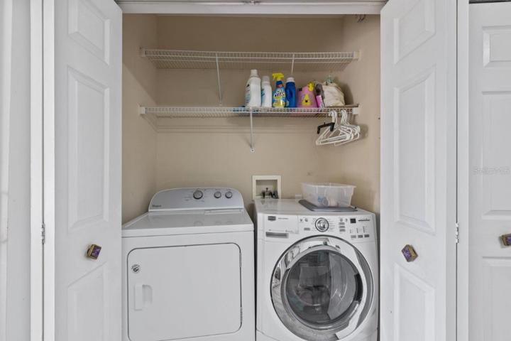 Laundry Closet located in the Kitchen