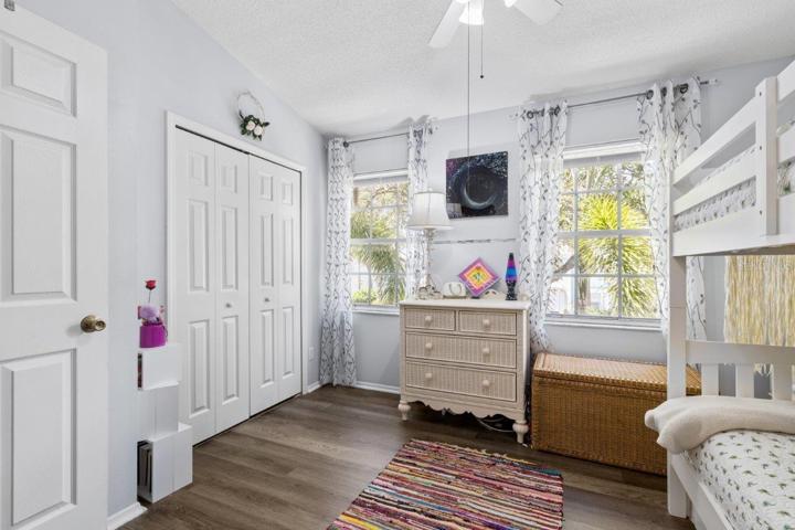 Second Bedroom Suite featuring lamanite flooring, and an en-suite bathroom.