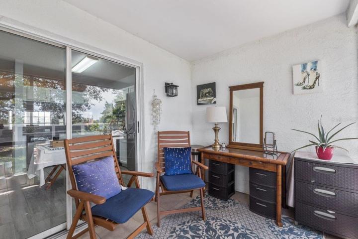 Tiled Screened-in Lanai with views of your semi-private back yard.