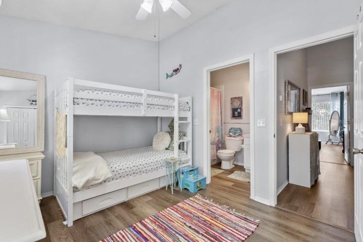 Second Bedroom Suite featuring lamanite flooring, and an en-suite bathroom.