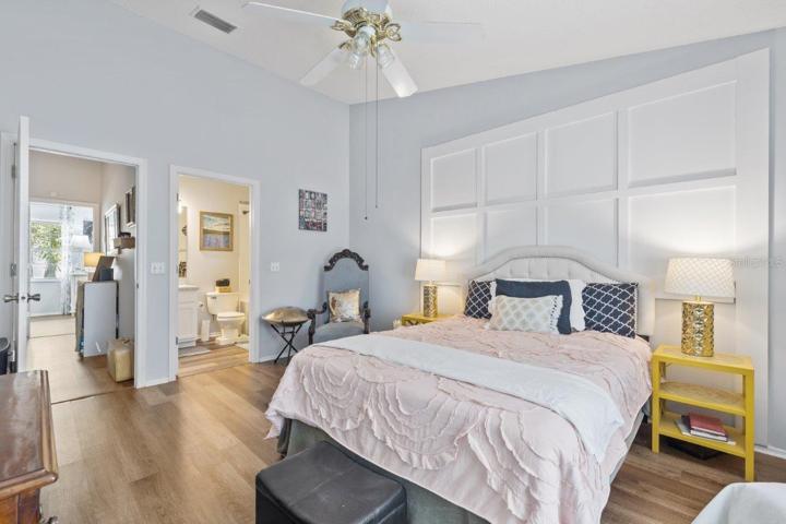 Main Owners suite featuring lamanite flooring, cathedral ceilings, and an ensuite bathroom