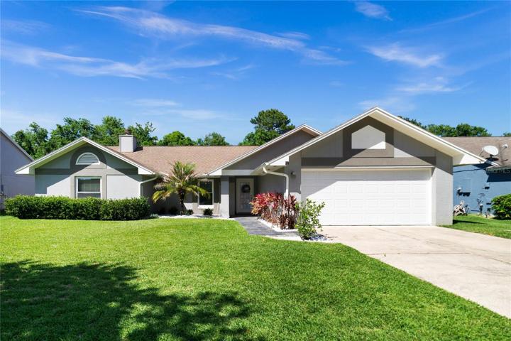 Alafaya Woods has a beautiful 3 bedroom, 2 bath home with an UPDATED KITCHEN and BATHS, new ENERGY EFFICIENT/IMPACT RATED WINDOWS and a NEW ROOF in a great location with CONSERVATION VIEWS!