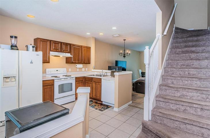 Kitchen and stairs from foyer