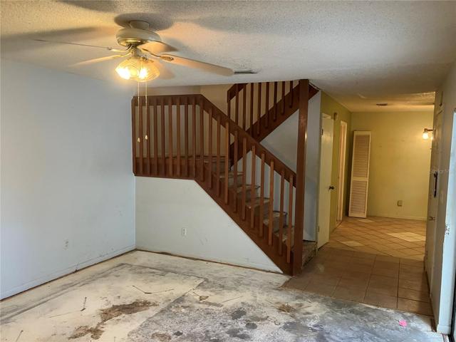 Casual dining area on other side of stairs.