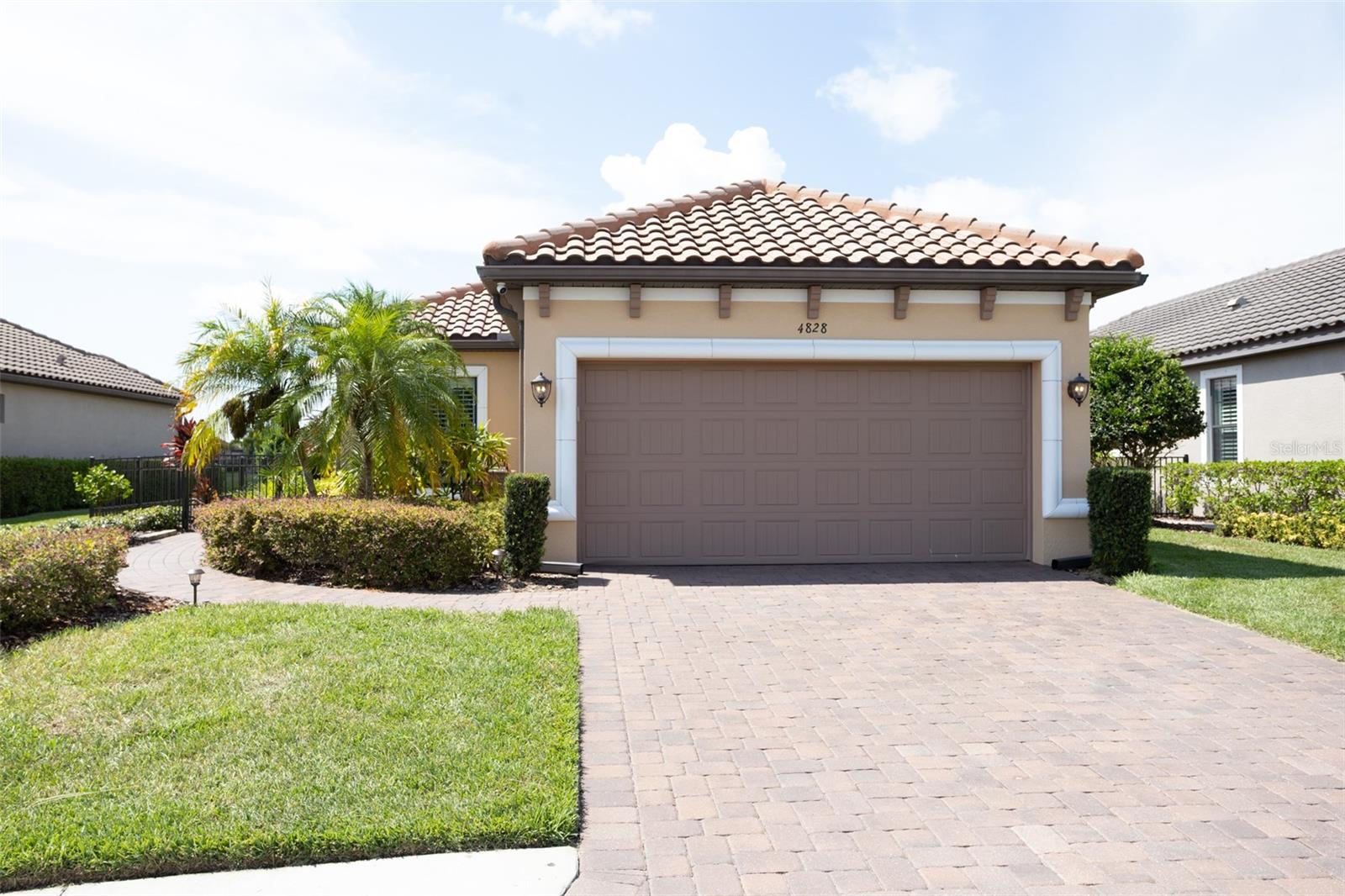 Two car garage with paver driveway.
