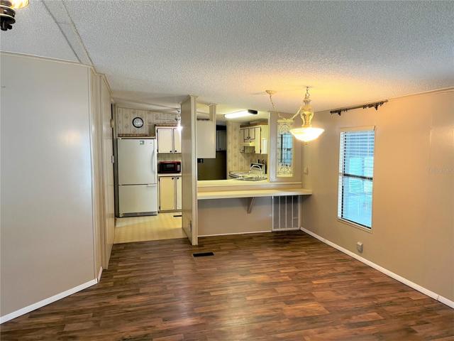 Dining Room with View of Kitchen
