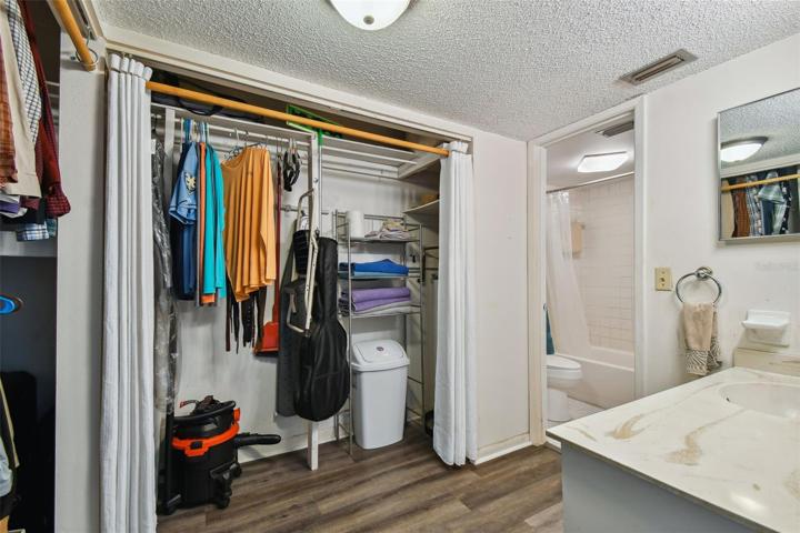 The vanity in the en-suite bathroom in the bedroom is separate from the toilet and tub/shower combo.