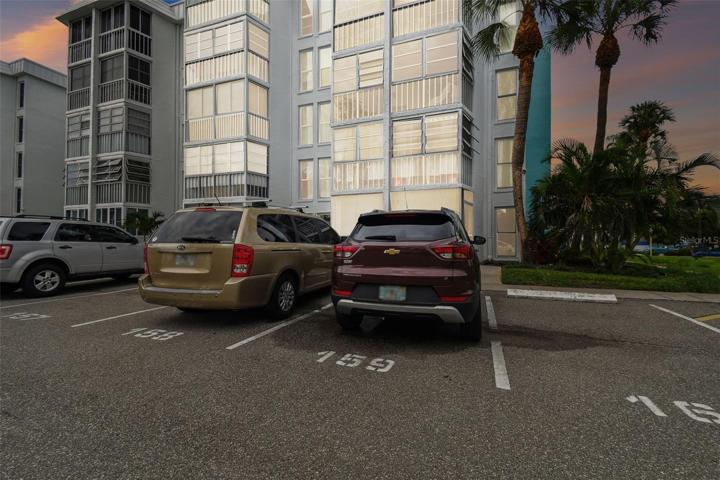 The unit's assigned parking space is 159 and is located in front of the building.