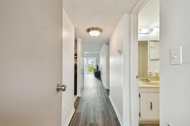 The 1 bedroom, 1.5 bathroom is located on the 5th floor and is flooded with natural light.  The half bath is pictured here on the right and the kitchen is the first opening on the left.