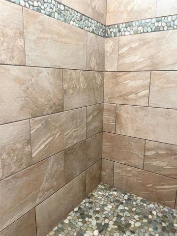 ELEGANT TILED ROMAN SHOWER