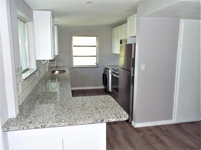 Front entry view of kitchen