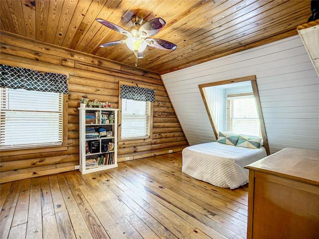 This second bedroom is bathed in natural light and there is plenty of room for 2 or 3 beds if needed!