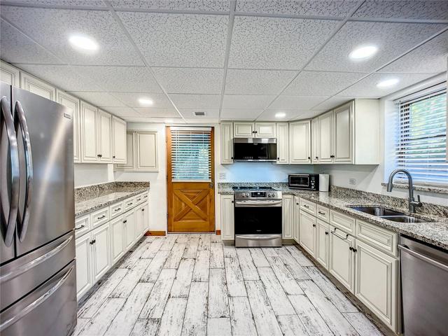 2022 stainless steel appliances, soft close custom cabinetry, LED lighting and new tile floors.