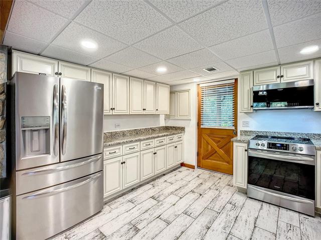 Kitchen opens up to the large 35 ft. long covered back porch.