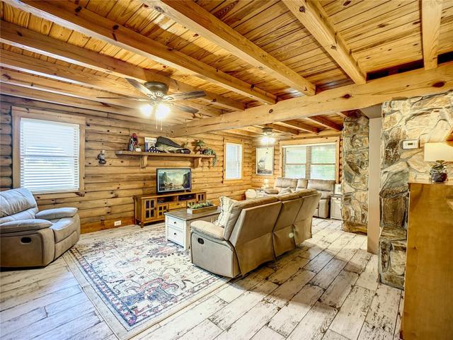 In love yet???  2022 tile floors throughout 1st floor.  Beautiful wood beams & stone walls bring the beauty of nature indoors.