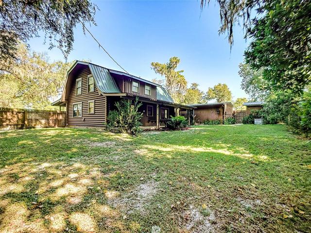 Private fenced backyard with access to the 2 car garage with workshop and the well pump housing the 2022 built $15,000 whole house reverse osmosis water filtration system.