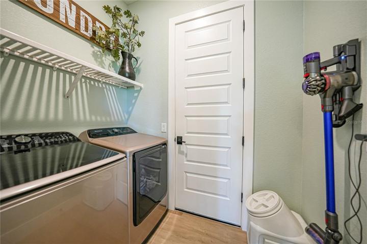 Laundry Room w/ Wood Shelving