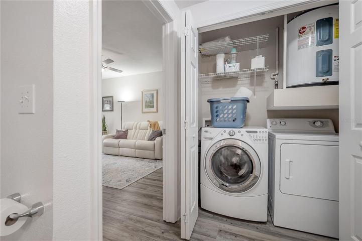 Laundry closet in bathroom.