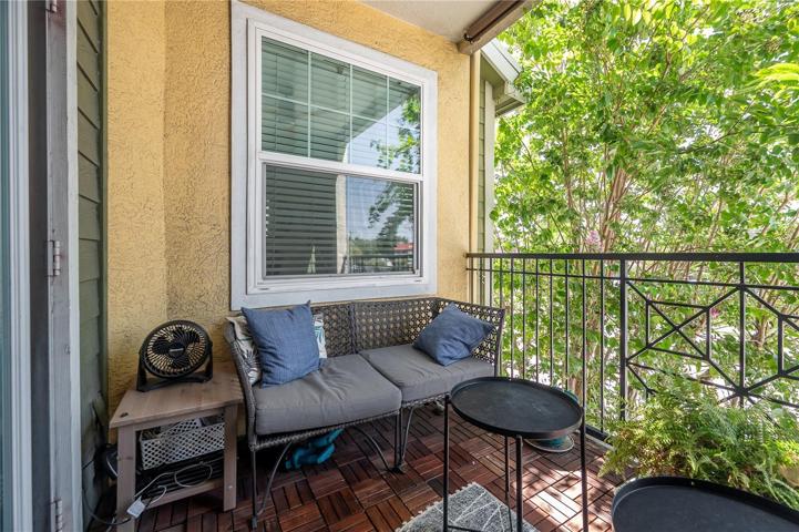 Unit Balcony w/natural shade from trees as well as added sunshade.