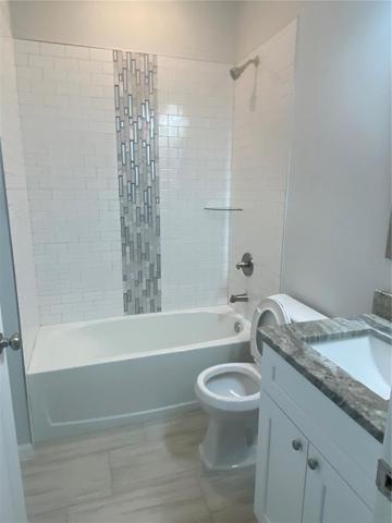 Hall Bath with tiled tub/shower combo