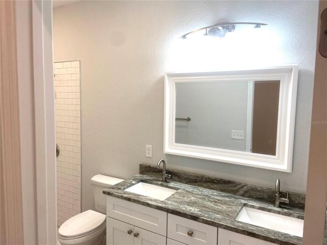 master bath with double granite vanity