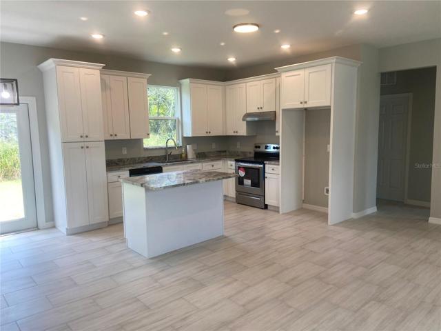 Kitchen, recessed lights, island & pantry