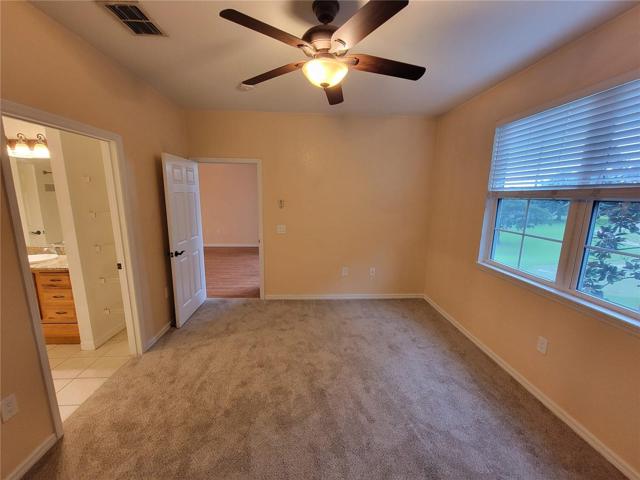 Primary Bedroom with walk-in closet, attached primary bathroom and beautiful views
