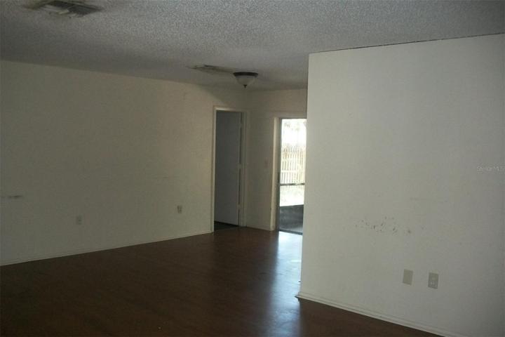 Living and Dining area Kitchen behide wall to the right.