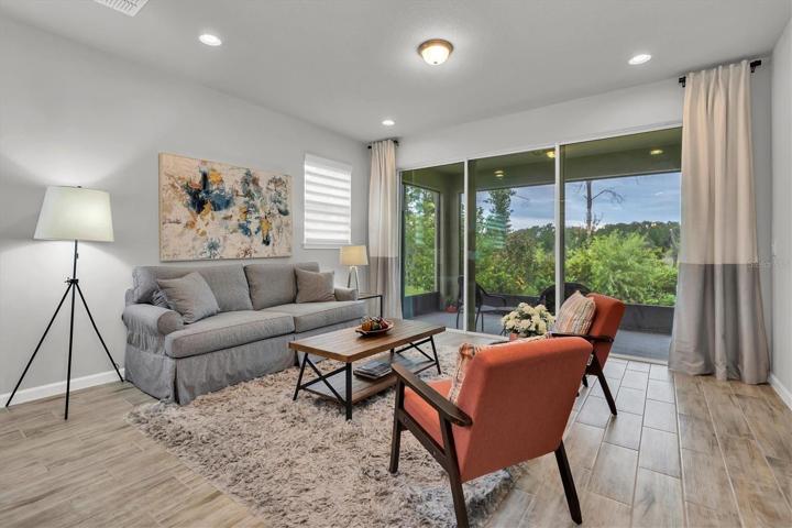 LIVING ROOM WITH A PRIVATE VIEW OF TREES