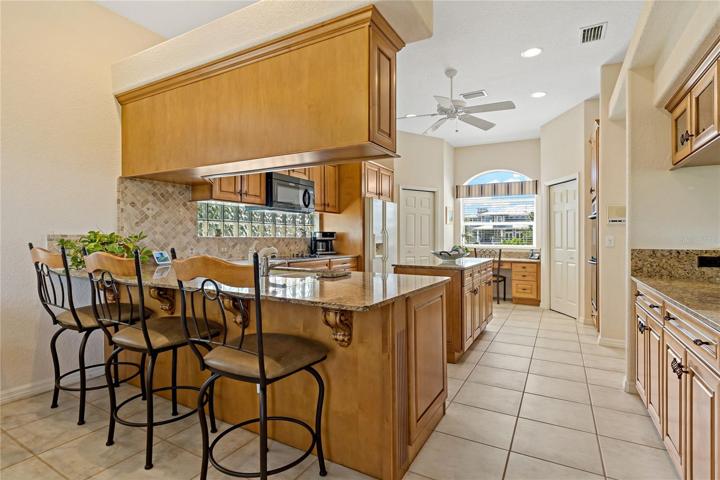 ROOM FOR BAR STOOLS AT THE BREAKFAST BAR IN THE KITCHEN!