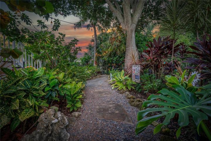 WALKWAYS ARE TUCKED AMONG LAYERS OF TROPICAL GREENS!