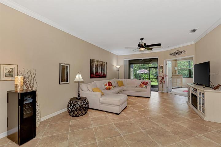 Ceramic tile on the diagonal. Charming living room.