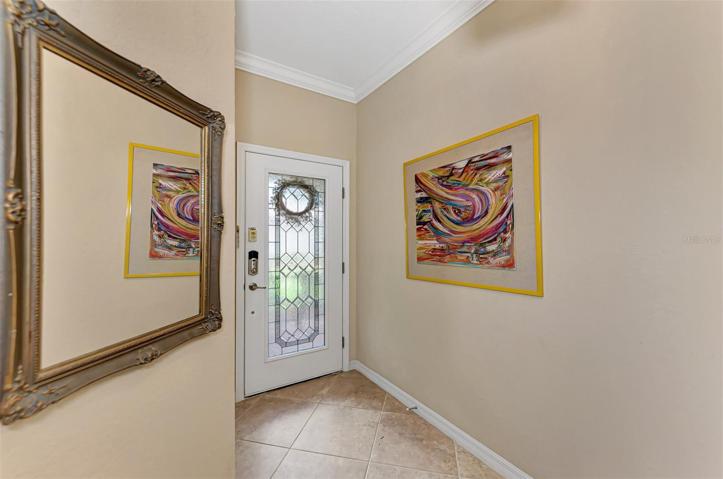 Private entry-way wit lovely etched-glass front door.