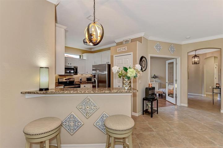 The white kitchen complements the neutral walls.