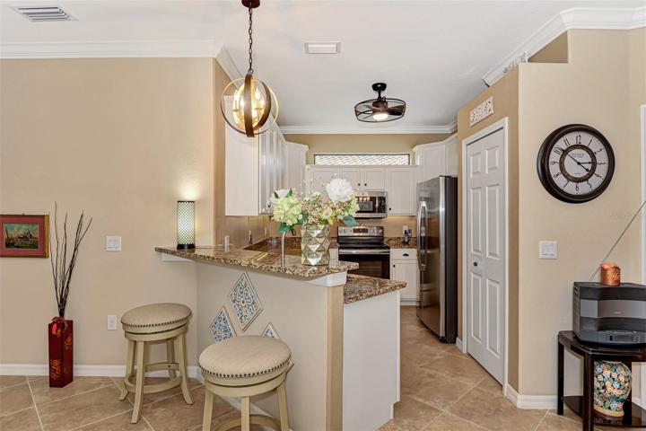 Transom window above stove brings added light to the kitchen.