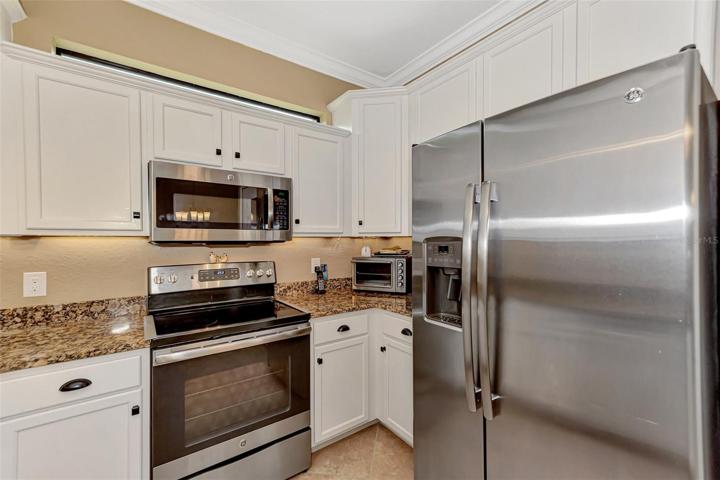 French door refrigerator, oven/stove and microwave only 5 1/2 years old.