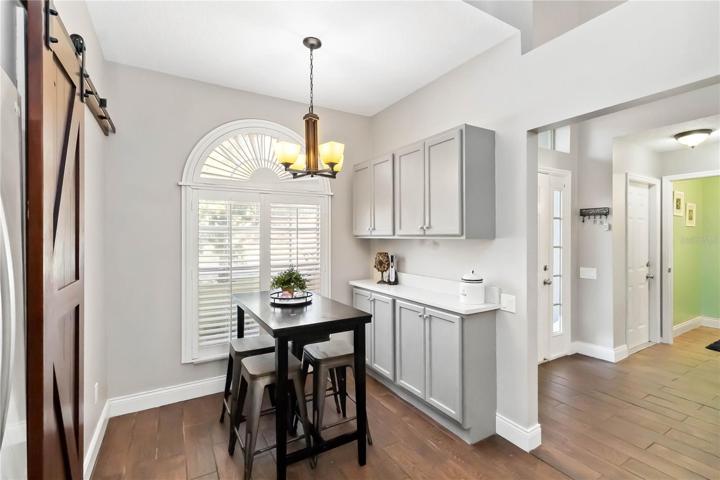 Charming window and barn door in dinette area