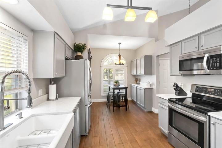 Farmhouse sink and updated faucet and light fixtures
