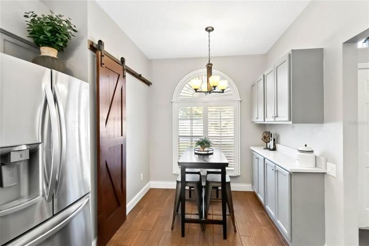 Another dining area with built in storage and quartz counters