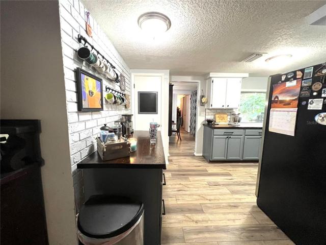 KITCHEN AND COFFEE BAR VIEW FROM FAMILY ROOM