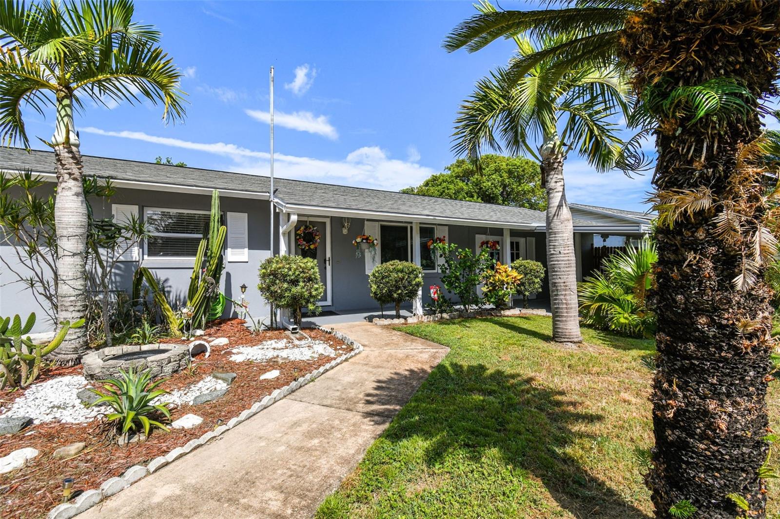 Landscaped entry path leads to the front door
