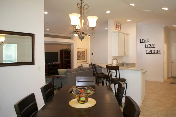 Dining table seats six with view of kitchen and living room. This home just feels bigger than the dimensions show.