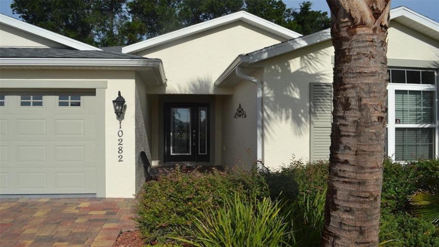 Stained glass entry doors with auto key-less programmable lock-set. Mature landscape. HOA takes care of all exterior grounds maintenance!