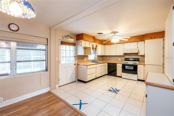 kitchen and eating areadoor to screened pool/patio