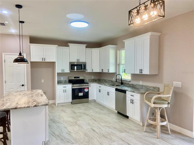 Dining to Kitchen, cabinets with Crown molding