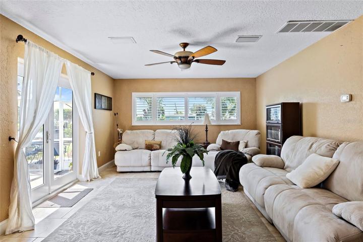 SECOND living space, doors give view of pool area